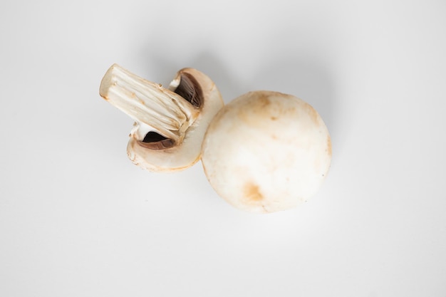 Fresh champignon mushrooms isolated on white background