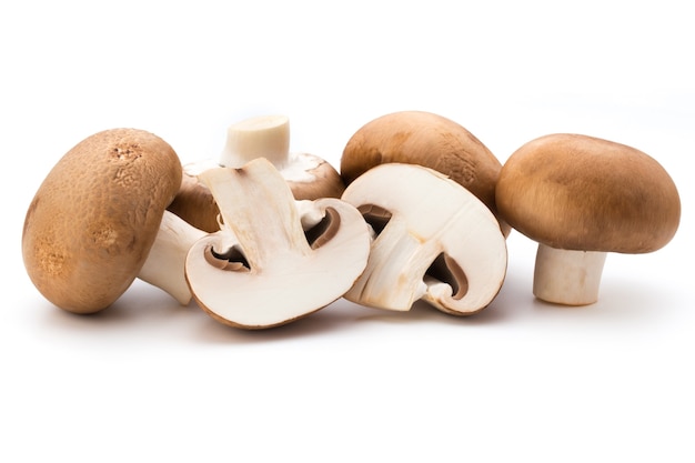 Fresh champignon mushrooms isolated on white.