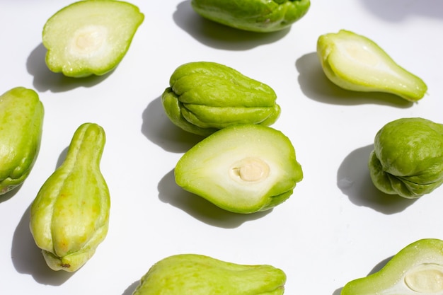 Fresh chayote fruit on white background.