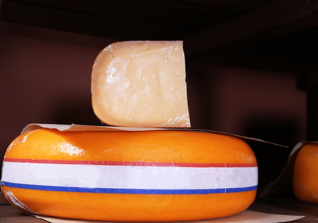 Fresh cheese on the shelf in cellar