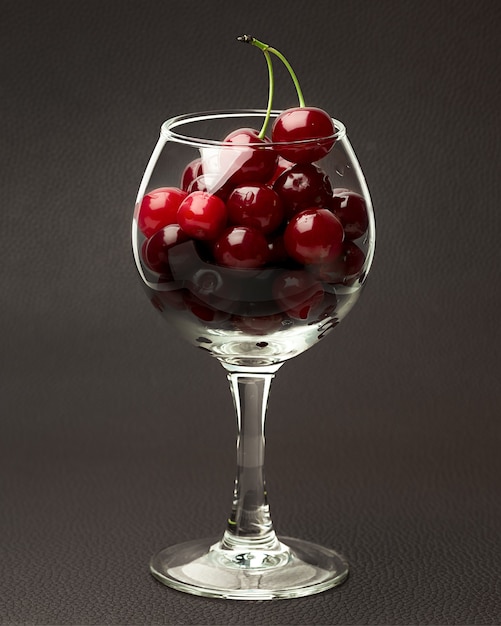 Fresh cherries in a glass goblet