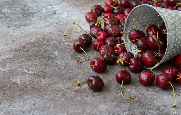 Fresh cherries in metal cup