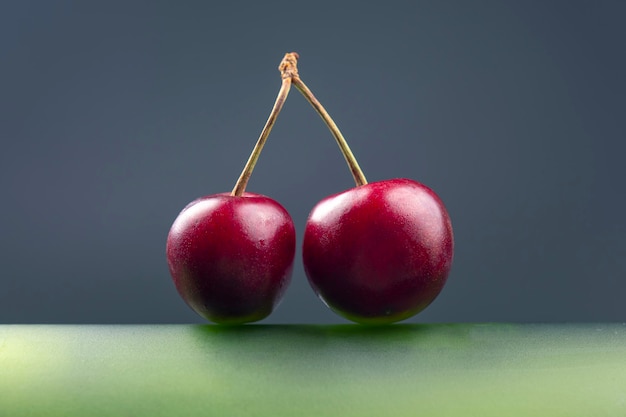 Fresh cherry berry on a green bottle