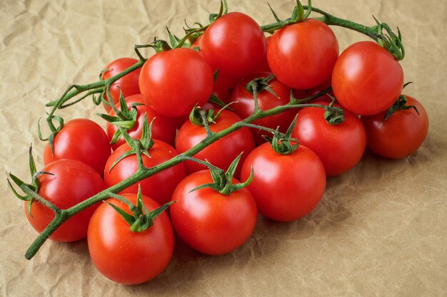 Fresh cherry tomatoes on crumpled paper background