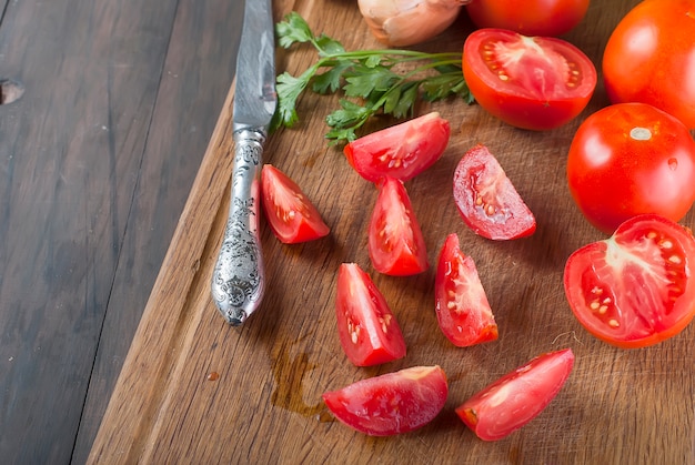 Fresh cherry tomatoes on old wooden table