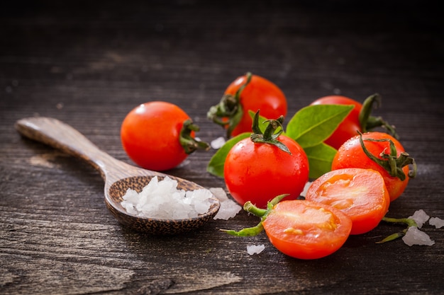 Fresh cherry tomatoes on table.