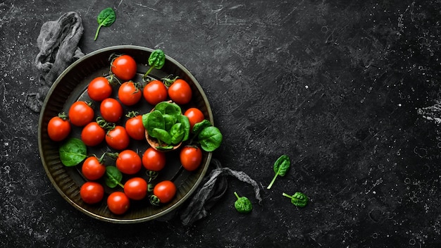 Fresh cherry tomatoes Top view On a stone background