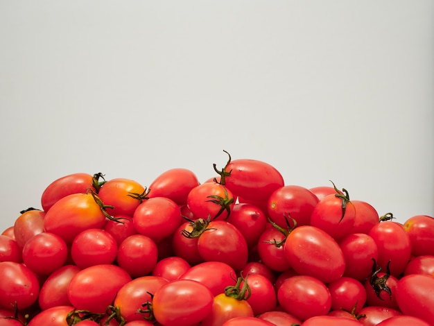 Fresh cherry tomatoes on white background