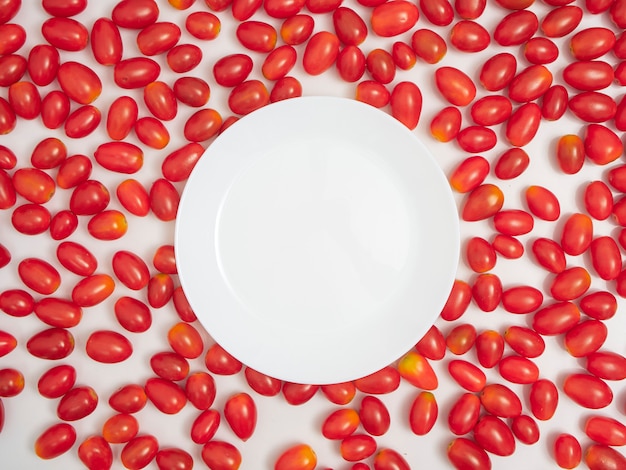 Fresh cherry tomatoes on white background