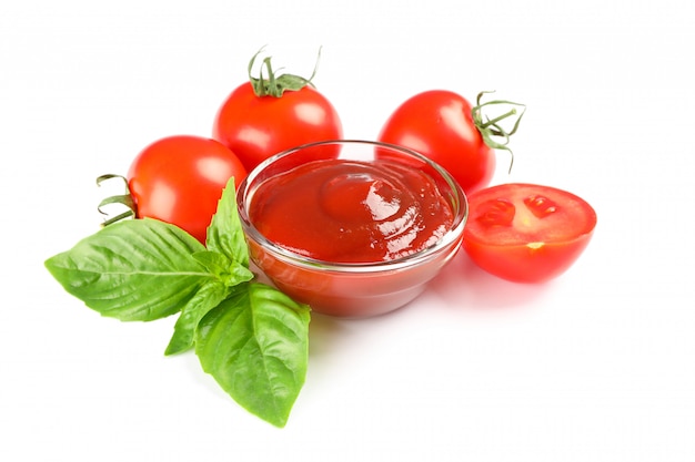 Fresh cherry tomatoes with basil and souce isolated on white space. Ripe vegetables