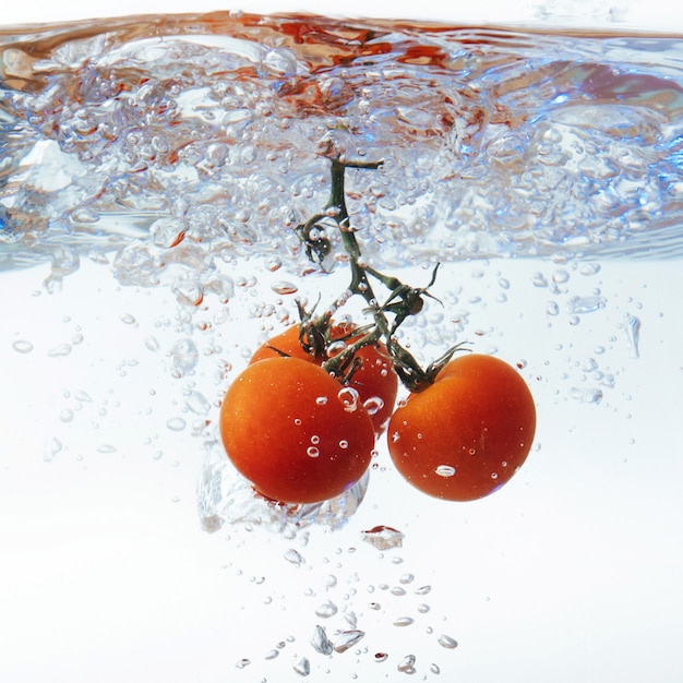 Fresh cherry tomatoes with water splash