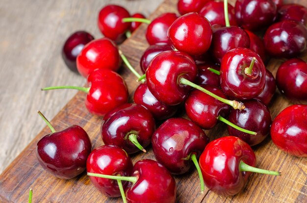 Fresh cherry on wooden .