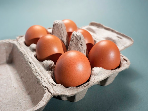 Fresh Chicken brown eggs on table