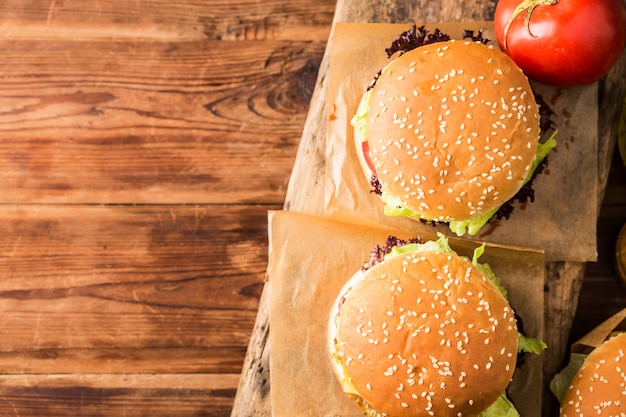 Fresh chicken burger on wooden table