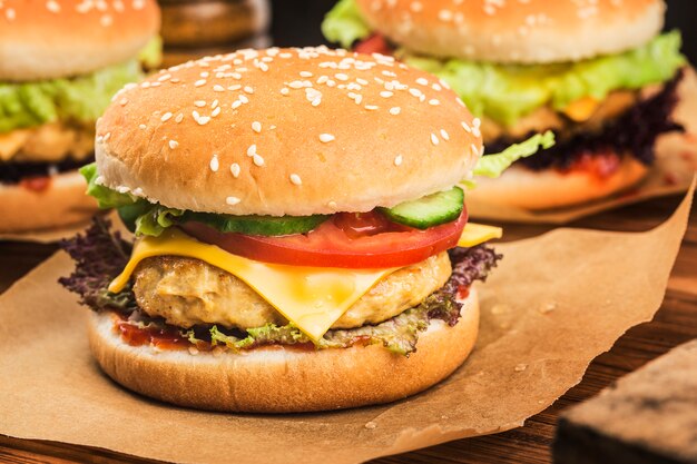 Fresh chicken burger on wooden table