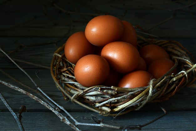 Fresh chicken egg. Wicker basket with chicken eggs. Easter egg.