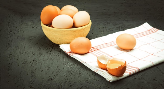 Fresh chicken eggs in a bowl closeup