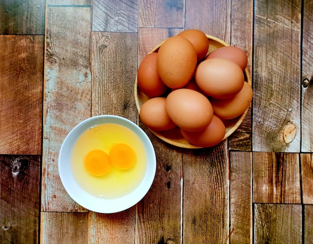 Fresh chicken eggs on a wooden table