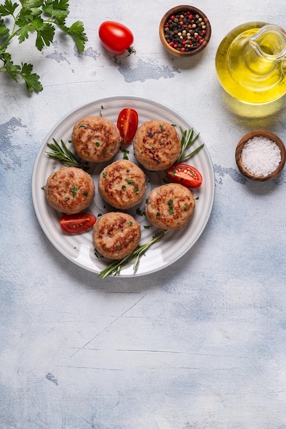 Fresh chiken cutlets with tomatoes and rosemary