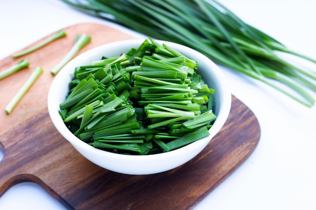 Fresh Chinese Chive leaves on white background.