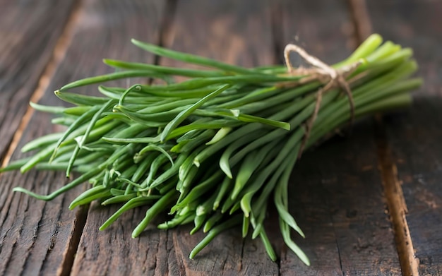 fresh chive on dark wooden table