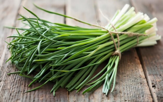 fresh chive on dark wooden table