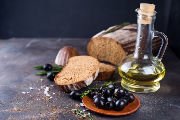 Fresh ciabatta with olive oil and olives