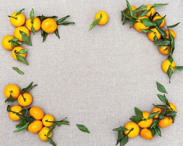 Fresh citrus fruits tangerine or mandarin on tablecloth