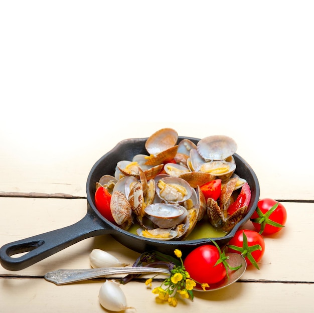 Fresh clams on an iron skillet