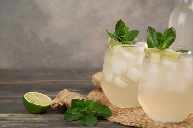 Fresh cocktail prepared with ginger beer lime and ice Beverage on the table Image contains copy space for text Fresh drink