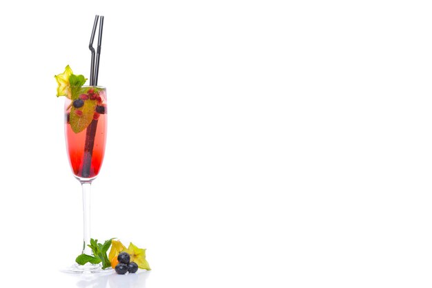 A fresh cocktail of tropical fruit and juice with ice Fresh fruit lime lemon mint kiwi Top view On a white background