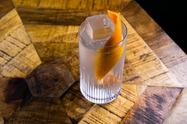 Fresh cocktail with orange and ice alcoholic nonalcoholic drinkbeverage at the bar counter