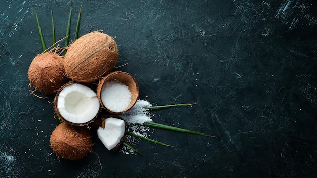 Fresh coconut on a black background Tropical Fruits Nut Top view Free space for your text