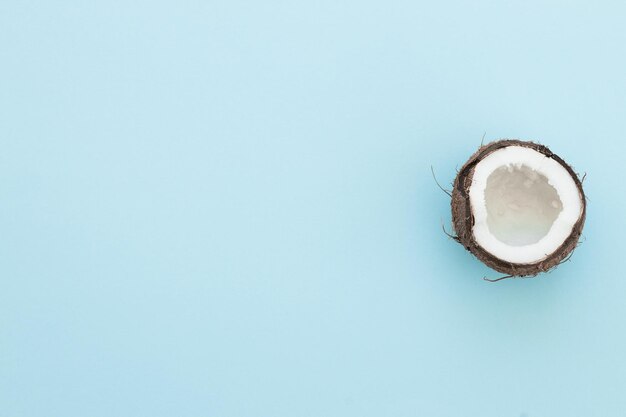 Fresh coconut on a blue background