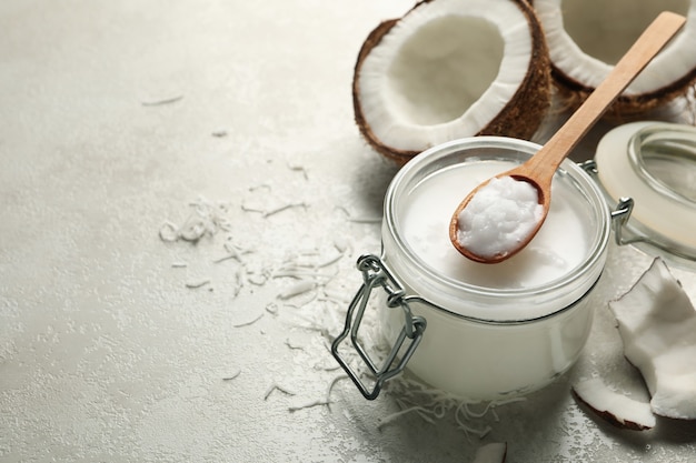 Fresh coconut and coconut milk on white background