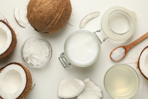 Fresh coconut and coconut milk on white