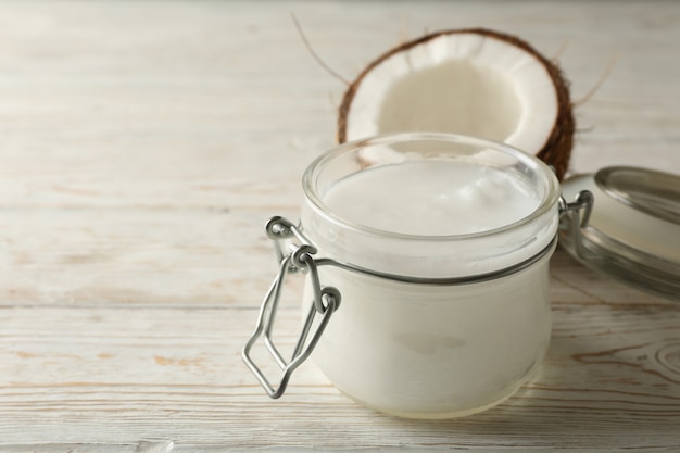 Fresh coconut and coconut milk on wooden