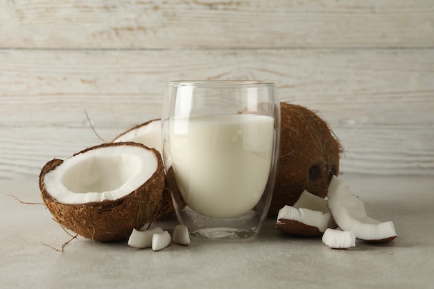 fresh coconut and coconut milk on wooden