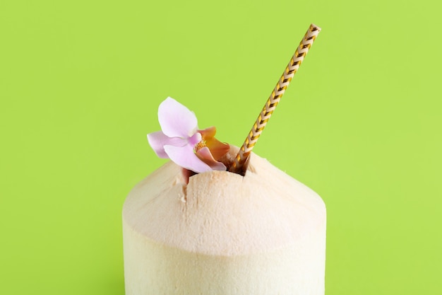 Fresh coconut on color surface, closeup