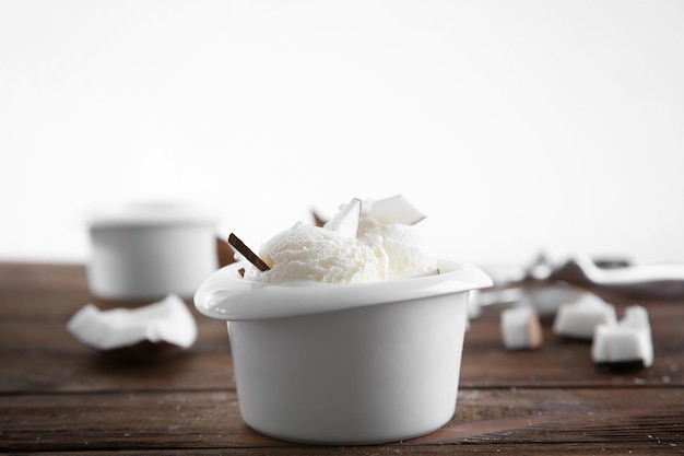 Fresh coconut ice cream on wooden table