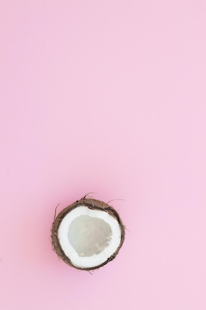 Fresh coconut on a pink background