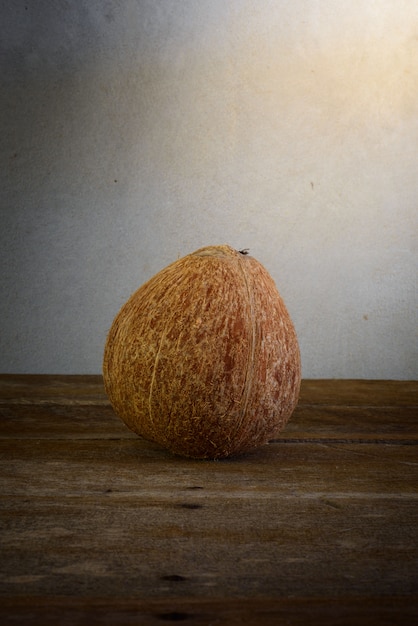 Fresh coconuts on old wooden