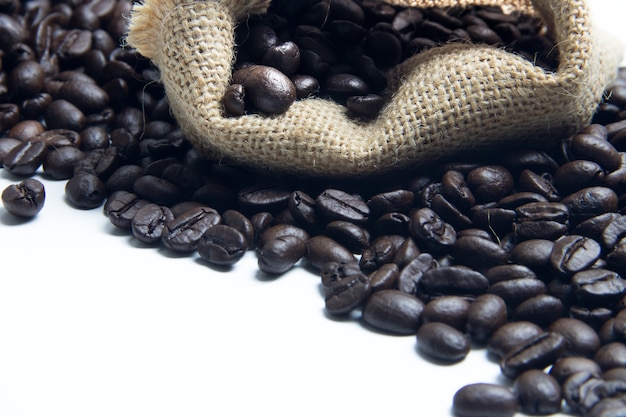 Fresh coffee bean in sack on white background 