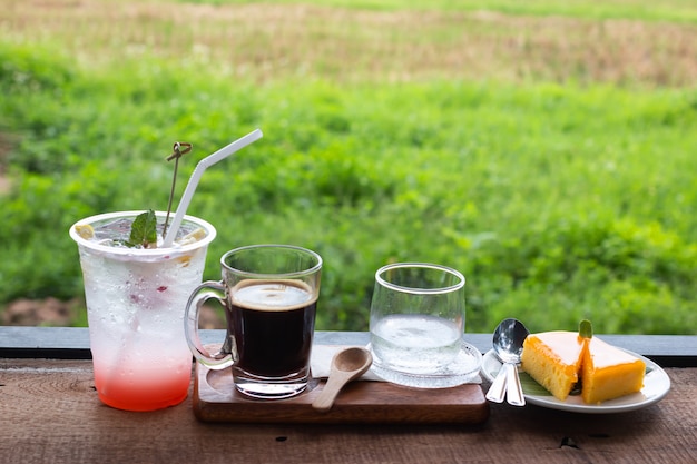 Fresh coffee in a glass and Orange cake and Lychee juice mixed with lime