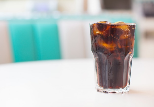 fresh cola drink on a white table into a american dinner restaurant