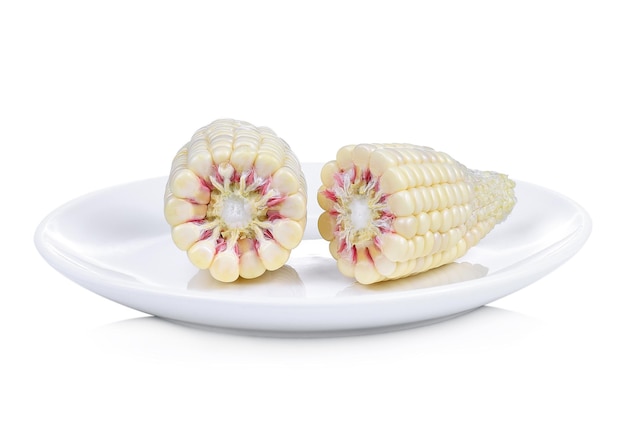 Fresh corn in plate isolated on white background