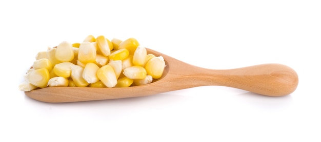 Fresh corn in wooden scoop isolated on white surface