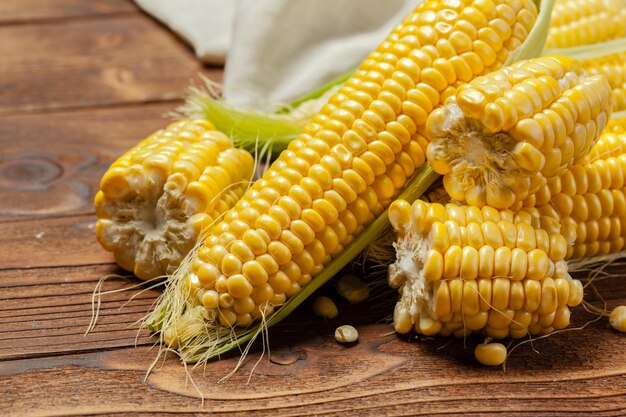 Fresh corn on wooden table