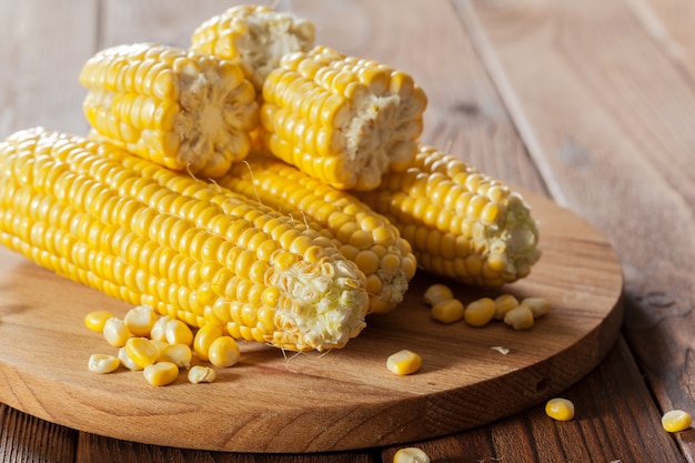 Fresh corn on wooden table