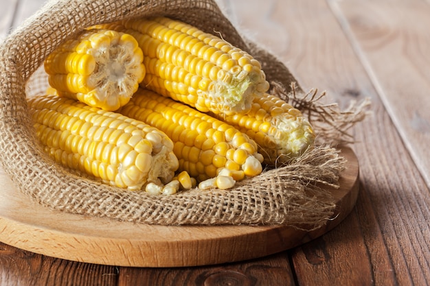 Fresh corn on wooden table